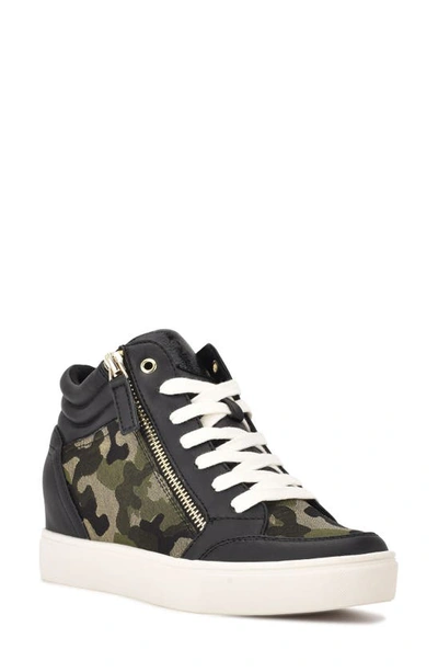 Shop Nine West Tons Lace-up Wedge Sneaker In Black/ Camo