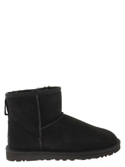 Shop Ugg Mini Classic - Boots In Black