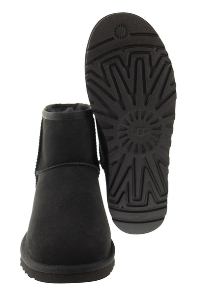 Shop Ugg Mini Classic - Boots In Black