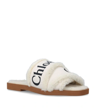 Shop Chloé Woody Logo Mules In White