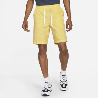 Shop Nike Sportswear Alumni Men's Woven Flow Shorts In Saturn Gold