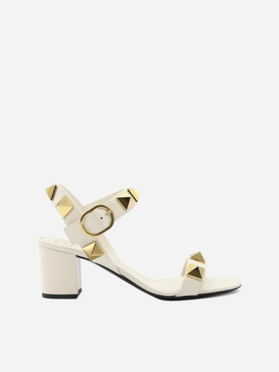 Shop Valentino Roman Stud Sandals In Leather In Ivory