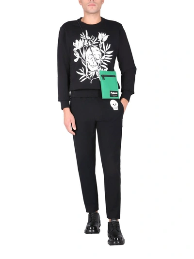 Shop Alexander Mcqueen Jogging Pants With Embroidered Skull In Black