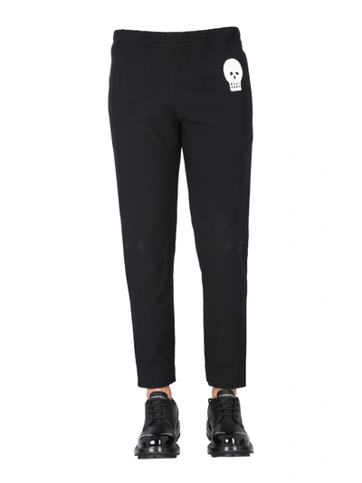 Shop Alexander Mcqueen Jogging Pants With Embroidered Skull In Nero