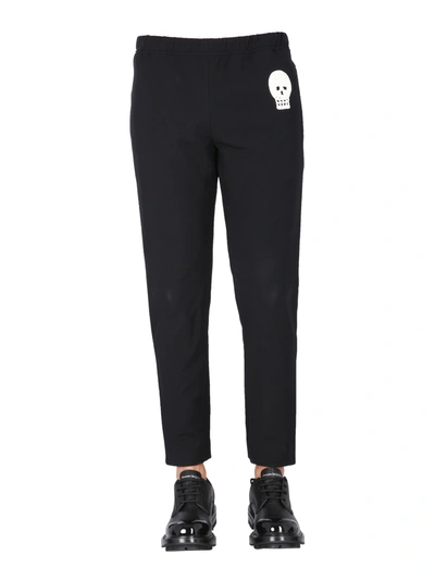 Shop Alexander Mcqueen Jogging Pants With Embroidered Skull In Black