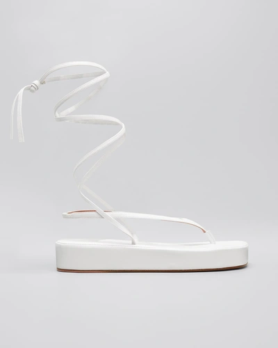 Shop Amina Muaddi Jamie Lambskin Ankle-wrap Flatform Sandals In White