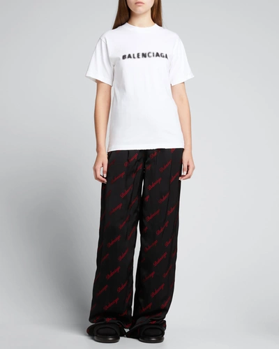 Balenciaga Distressed Logo-print Cotton-jersey T-shirt In Blanc/noir