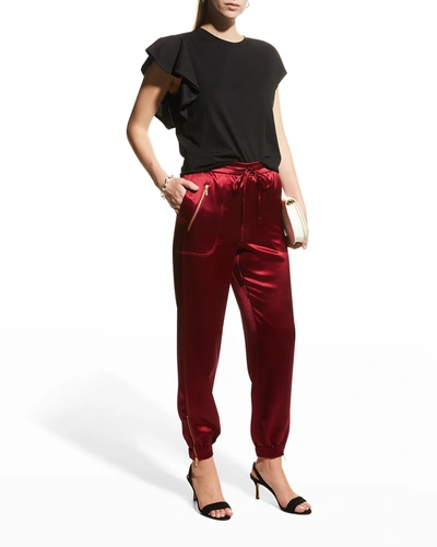 Shop Milly Rylan Hammered Satin Jogger Pants In Wine
