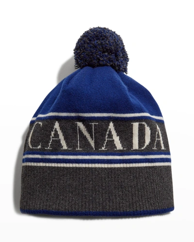 Shop Canada Goose Logo Toque Beanie Hat W/ Pompom In Northern Night