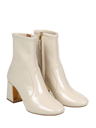 Tory Burch Gigi Boots In Stretch Patent Leather In White | ModeSens