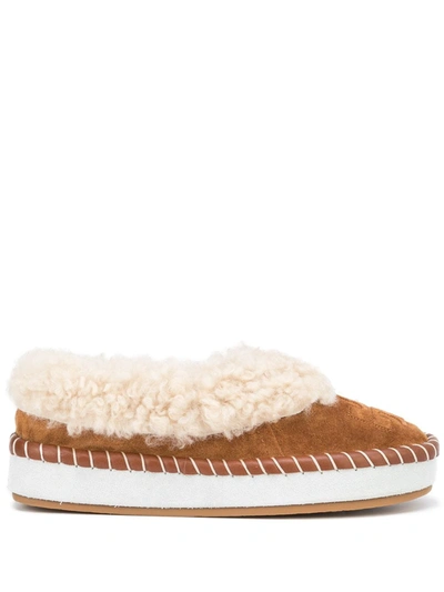 Shop Tory Burch Logo-embossed Shearling Slippers In Brown