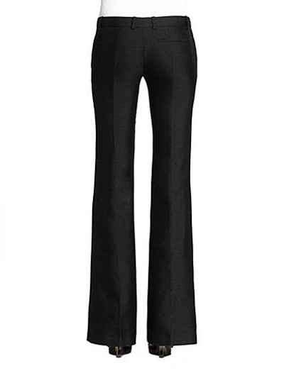 Shop Alexander Mcqueen Wool Flared Trousers In Black