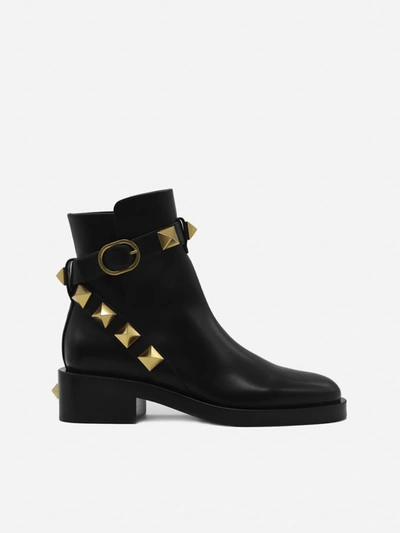 Shop Valentino Garavani Roman Stud Leather Ankle Boots In Black