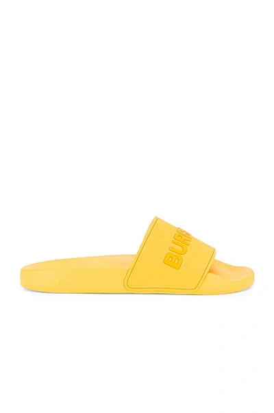 Shop Burberry Furley Solid Slide In Yellow