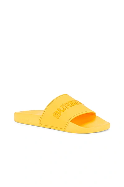 Shop Burberry Furley Solid Slide In Yellow