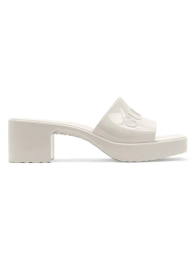 Shop Gucci Women's Embossed Logo Mules In Mystic White