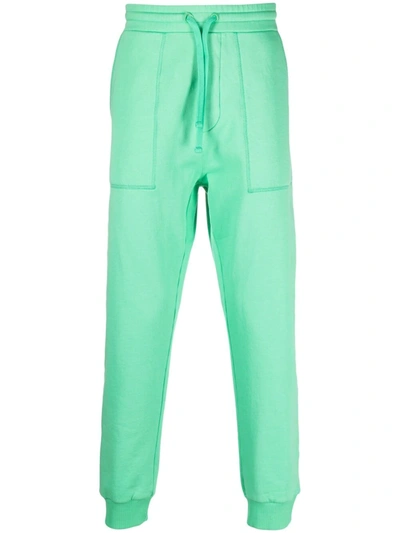 Shop Nanushka High-waisted Tapered Trousers In Green