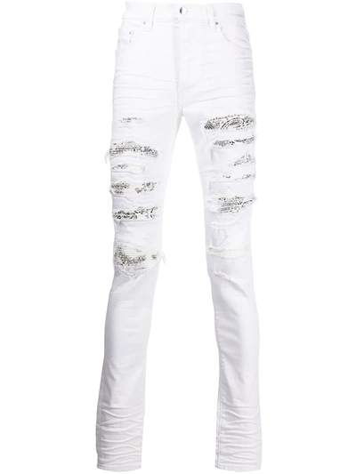 Shop Amiri Bandana-detail Distressed-effect Jeans In White
