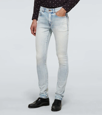 Shop Saint Laurent Skinny-fit Faded Jeans In Blue
