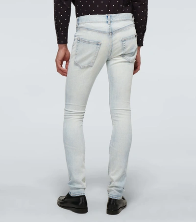 Shop Saint Laurent Skinny-fit Faded Jeans In Blue