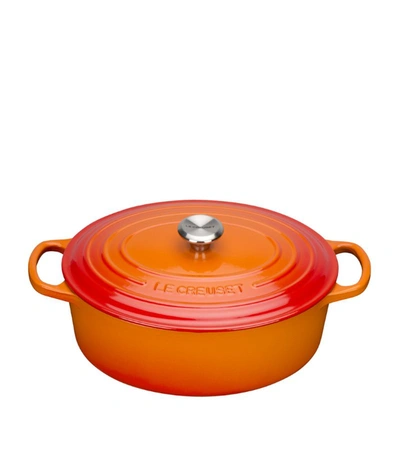 Shop Le Creuset Cast Iron Oval Casserole Dish (29cm) In Orange