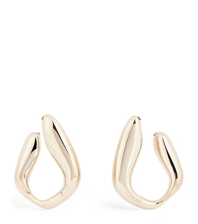 Shop Chloé Asymmetric Kiss Hoop Earrings In Gold