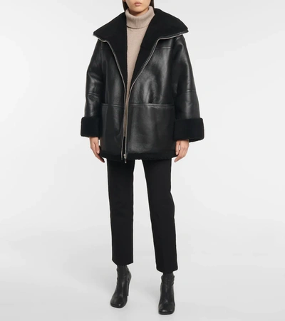 Shop Totême Shearling-lined Leather Jacket In Black