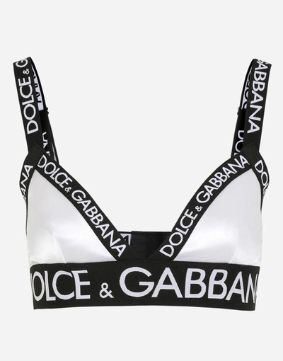 Shop Dolce & Gabbana Satin Triangle Bra With Logo In White