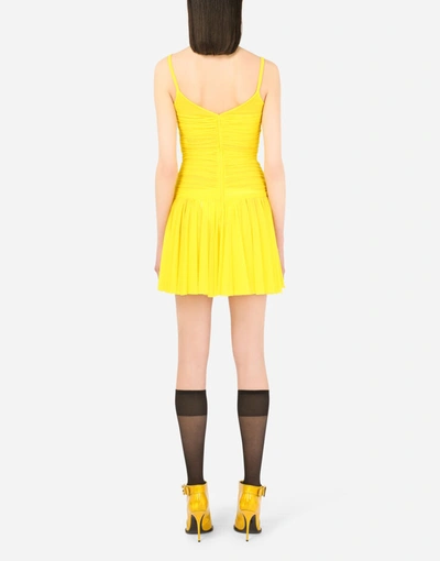 Shop Dolce & Gabbana Draped Tulle Minidress With Peplum In Yellow