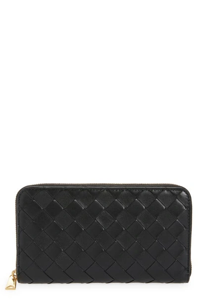 Shop Bottega Veneta Intrecciato Leather Continental Wallet In Black Gold