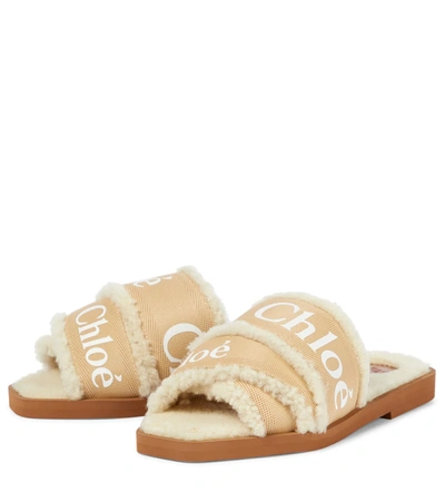 Shop Chloé Woody Shearling-lined Slides In Beige