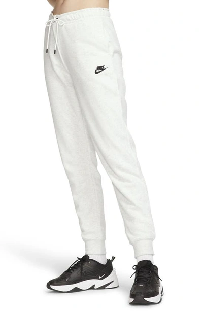 Shop Nike Sportswear Essential Fleece Pants In Pink Glaze/heather/black