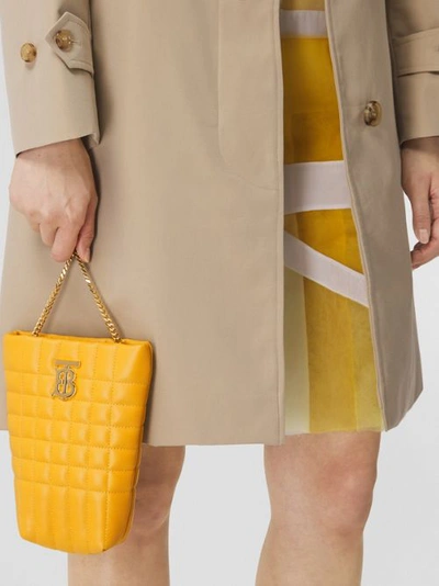 Shop Burberry Micro Quilted Lambskin Lola Bucket Bag In Deep Saffron