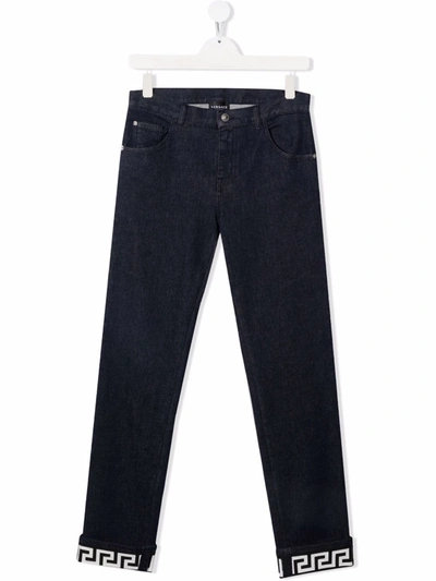 Shop Versace Greca Slim-cut Jeans In Blue