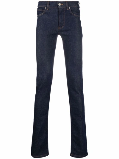 Shop Versace Logo-patch Skinny-cut Jeans In Blue