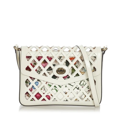 Shop Gucci Traforata Cutout Flora Leather Crossbody Bag In White