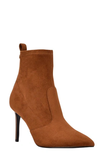 Shop Guess Dafina Pointy Toe Bootie In Cognac