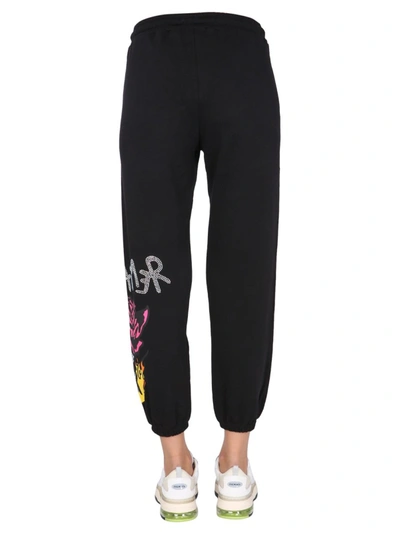 Shop Disclaimer Jogging Pants With Rhinestones Logo In Black