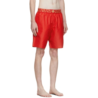 Shop Versace Red Greca Swim Shorts In A9x2 Red