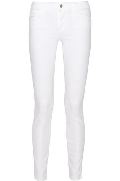 Shop J Brand 811 Mid-rise Skinny Jeans In White