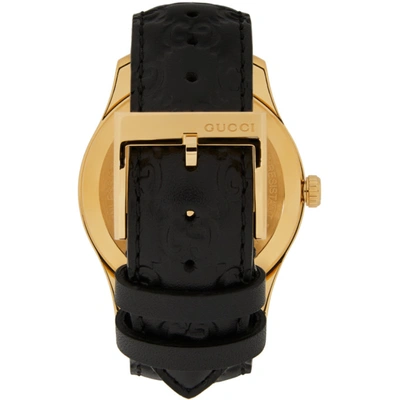 Shop Gucci Gold & Black Embossed G-timeless Watch In Black/gold
