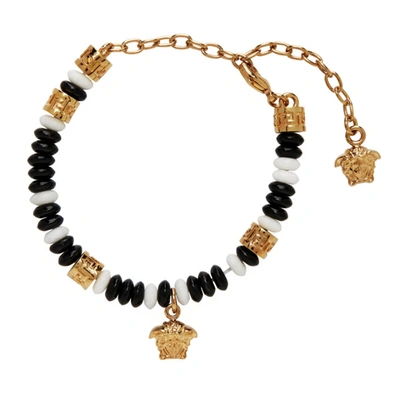 Shop Versace Black & White Beaded Medusa Charm Bracelet In Dwnov White/black