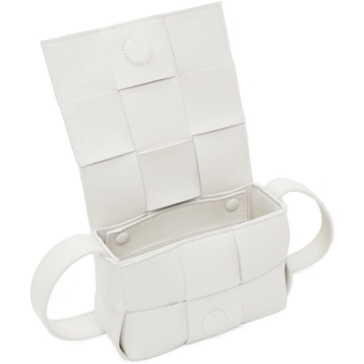 Shop Bottega Veneta White Belt Cassette Bag In 9009 White Gold