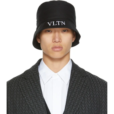 Shop Valentino Black 'vltn' Bucket Hat In 0ni Nero/bianco