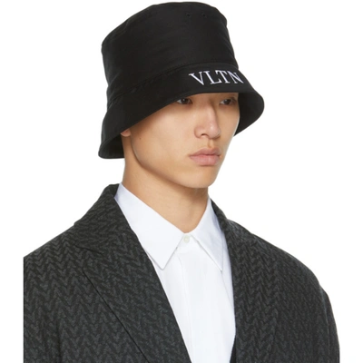 Shop Valentino Black 'vltn' Bucket Hat In 0ni Nero/bianco