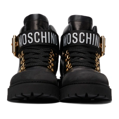 Shop Moschino Black Buckle Logo Boots In 00a Fantasycolor
