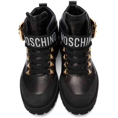 Shop Moschino Black Buckle Logo Boots In 00a Fantasycolor