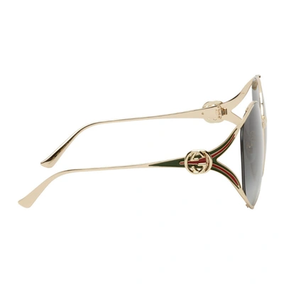 Shop Gucci Gold Enamel Stripe Round Sunglasses In 001