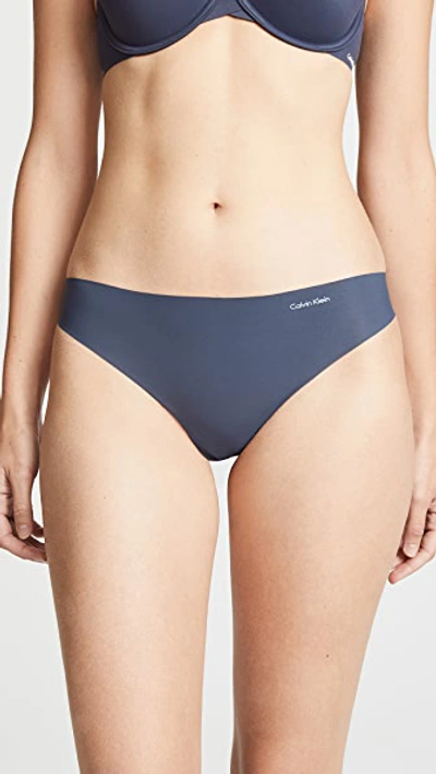 Shop Calvin Klein Underwear Invisibles Thong 3 Pack Speakeasy/light Caramel/black