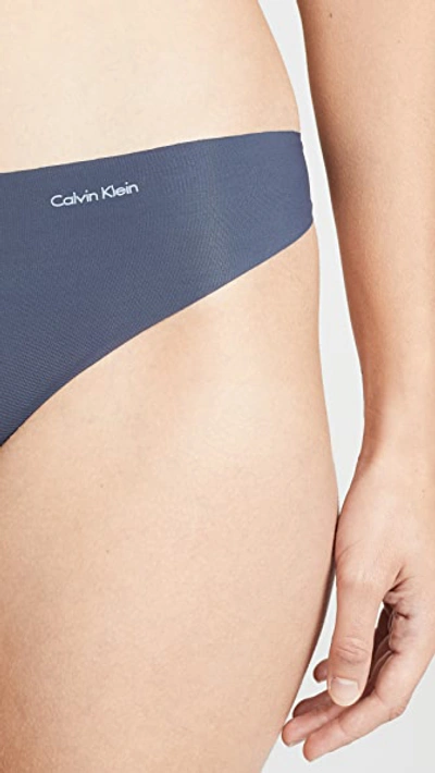 Shop Calvin Klein Underwear Invisibles Thong 3 Pack Speakeasy/light Caramel/black